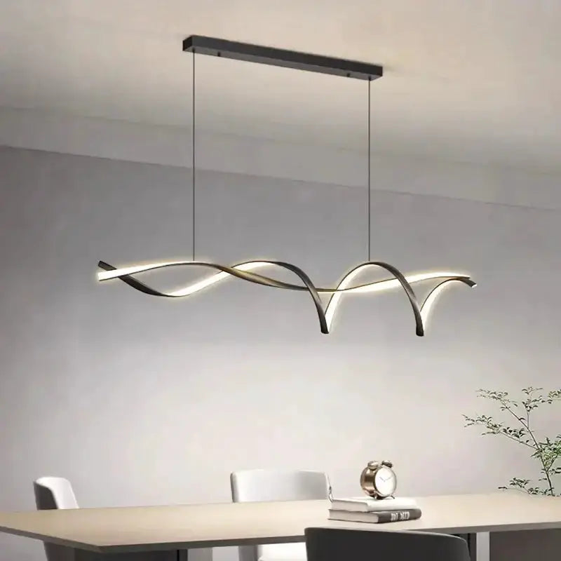 Chandelier Decorbites black and gold wave LED glass pendant light over dining table on Tampa Home & Garden Store