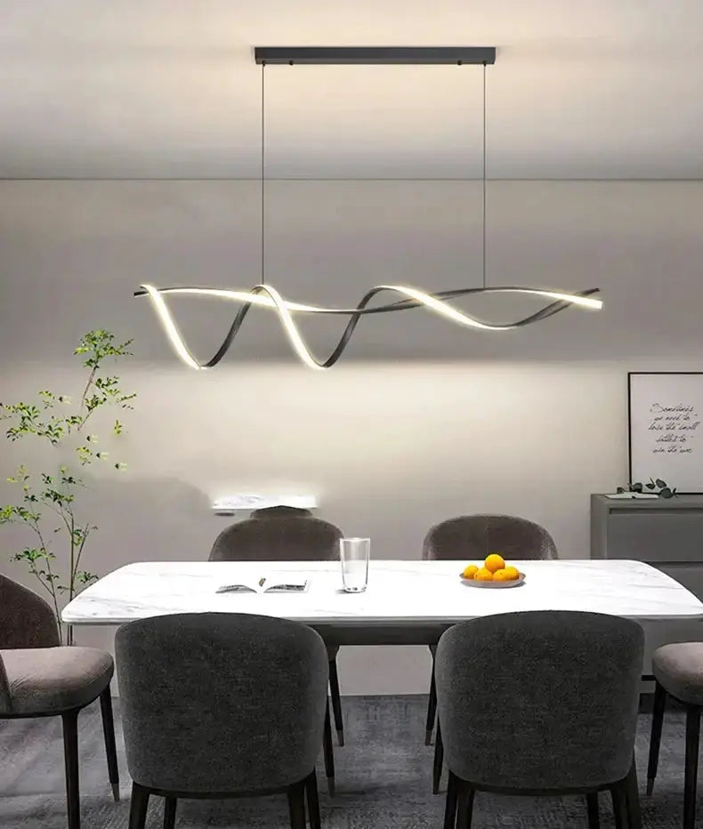 Chandelier modern black and gold wave LED glass pendant light by Decorbites over dining area on Tampa Home & Garden Store