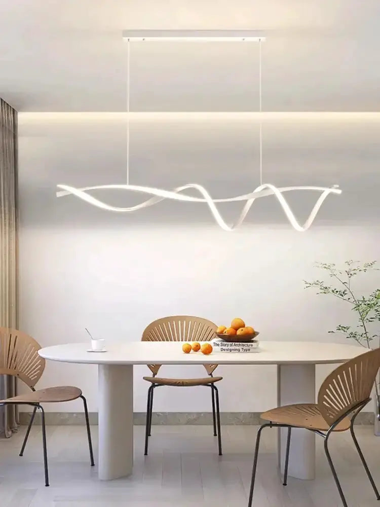 Chandelier modern wave LED glass pendant light with white glow over dining table on Tampa Home & Garden Store
