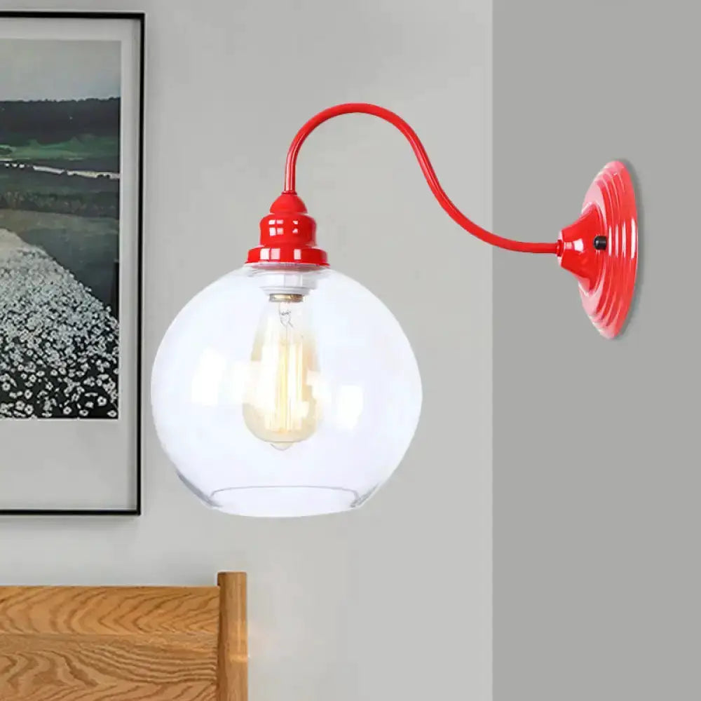 Industrial red metal wall sconce with clear glass globe by Decorbites on Tampa Home & Garden Store