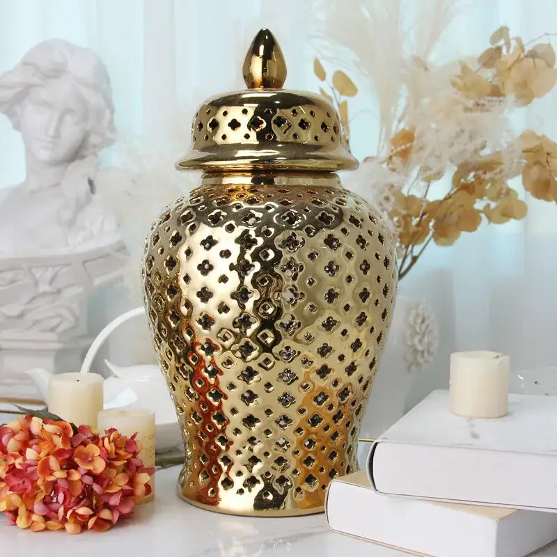 Gold ceramic temple jar vase by Decorbites with perforated lattice pattern and lid on Tampa Home & Garden Store