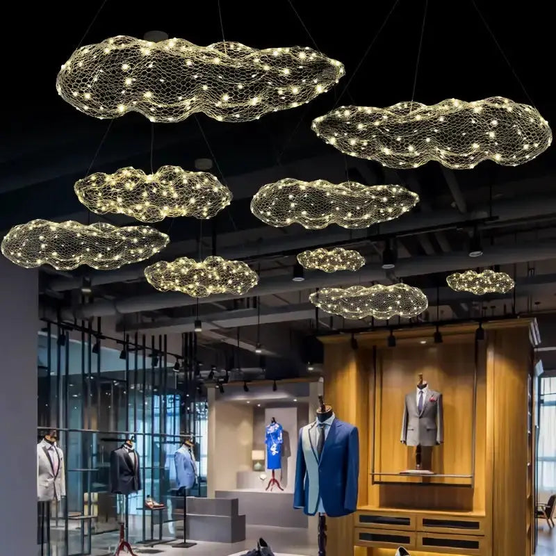 Modern gold mesh cloud pendant lights chandelier with LED glow, cloud-shaped fixtures in showroom on Tampa Home & Garden Store
