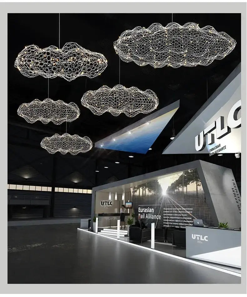 Modern gold mesh cloud LED pendant light chandelier by Decorbites hanging in showroom on Tampa Home & Garden Store