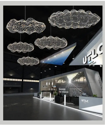 Modern gold mesh cloud LED pendant light chandelier by Decorbites hanging in showroom on Tampa Home & Garden Store
