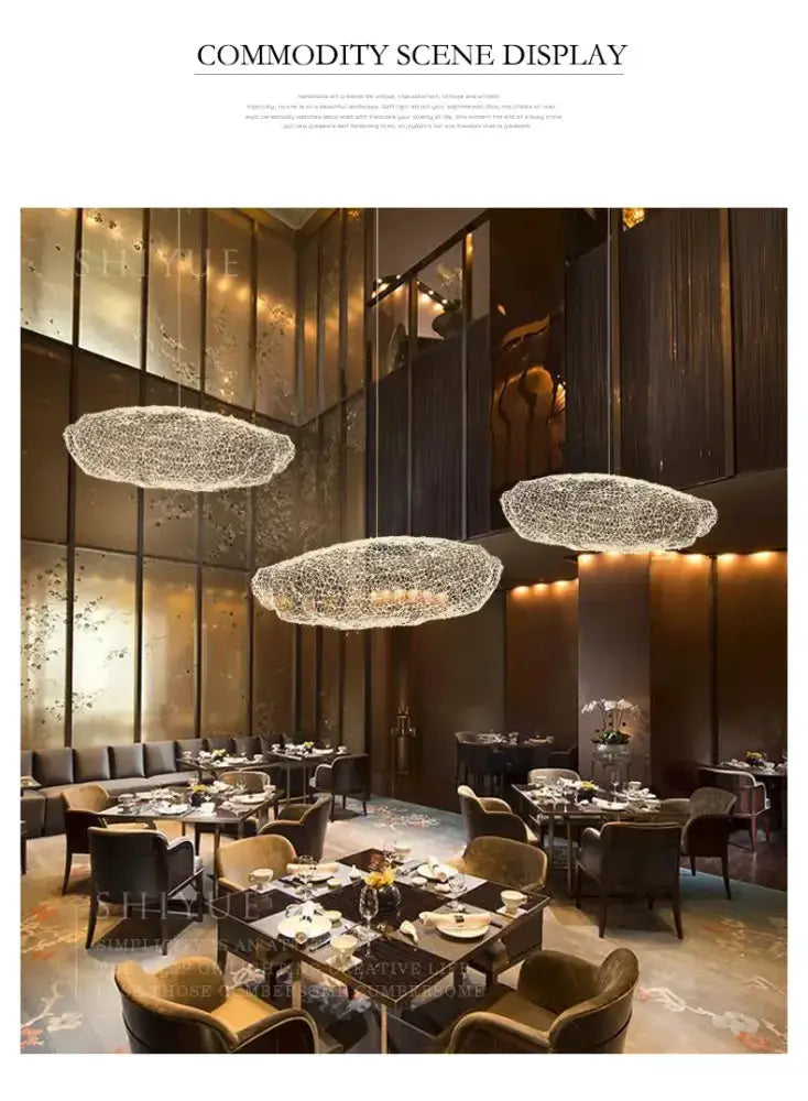 Modern gold mesh cloud pendant chandelier; three LED cloud fixtures above dining on Tampa Home & Garden Store
