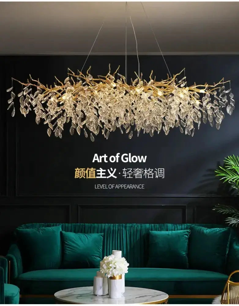 Chandelier gold crystal LED branch with crystal leaves, lighting over teal dining seating on Tampa Home & Garden Store