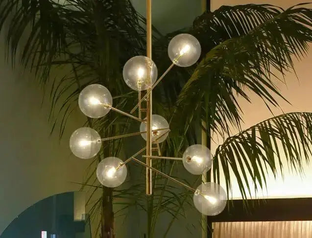 Modern gold glass bubble starburst chandelier by Decorbites with nine glass globes on Tampa Home & Garden Store