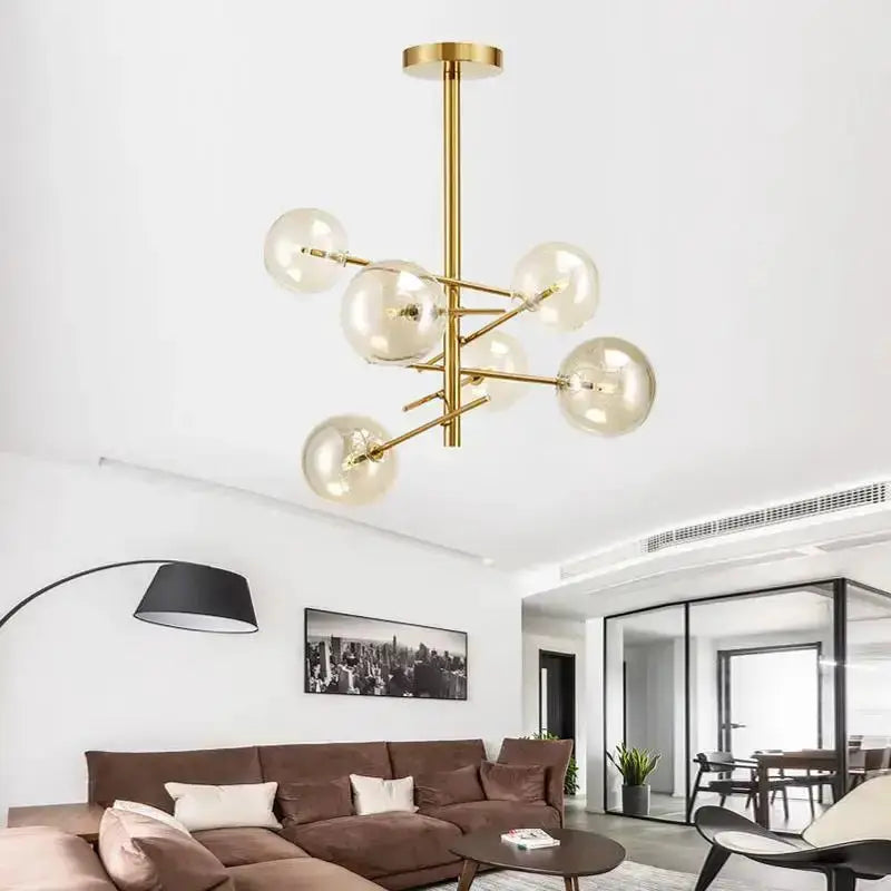 Chandelier, modern gold glass bubble starburst with multiple globes over living room area on Tampa Home & Garden Store