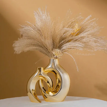 Golden Ceramic Flower Vase by Decorbites, sculptural interlocking rings, pampas grass on Tampa Home & Garden Store