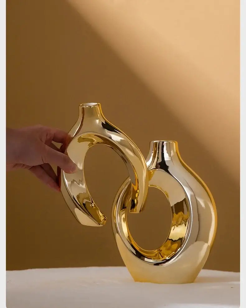 Golden ceramic flower vase with intertwined circular loops, high-shine gold finish on Tampa Home & Garden Store
