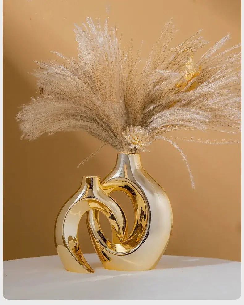 Golden ceramic flower vase with interlocking loop design by Decorbites, pampas grass arrangement on Tampa Home & Garden Store