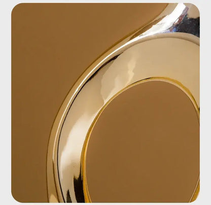 Decorbites Golden ceramic flower vase with gold metallic finish and curved rim on Tampa Home & Garden Store