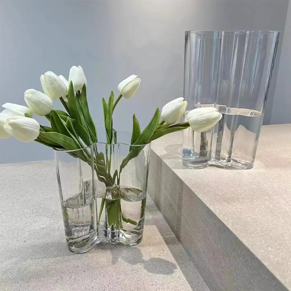 Emerald Glass Wavy Vase by Decorbites with white tulips beside a tall ribbed clear vase on Tampa Home & Garden Store