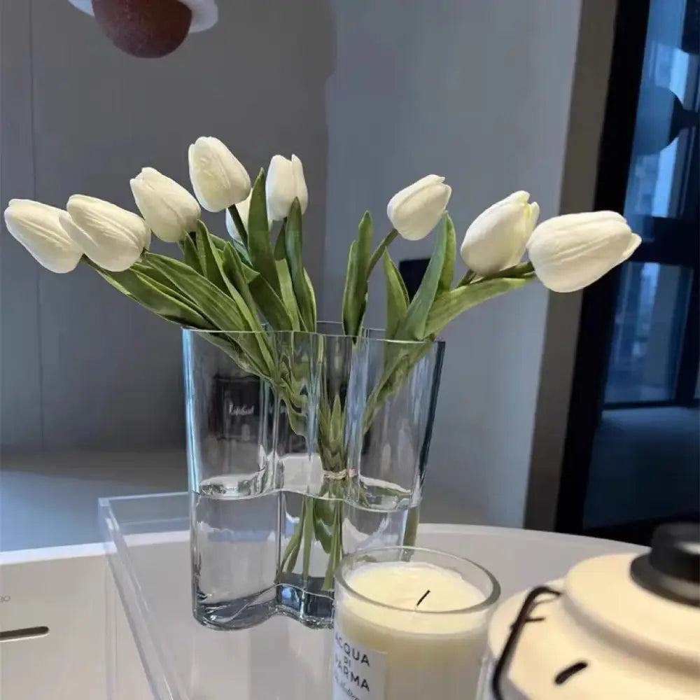 Emerald glass wavy vase by Decorbites with white tulips in a two-compartment clear vase on Tampa Home & Garden Store