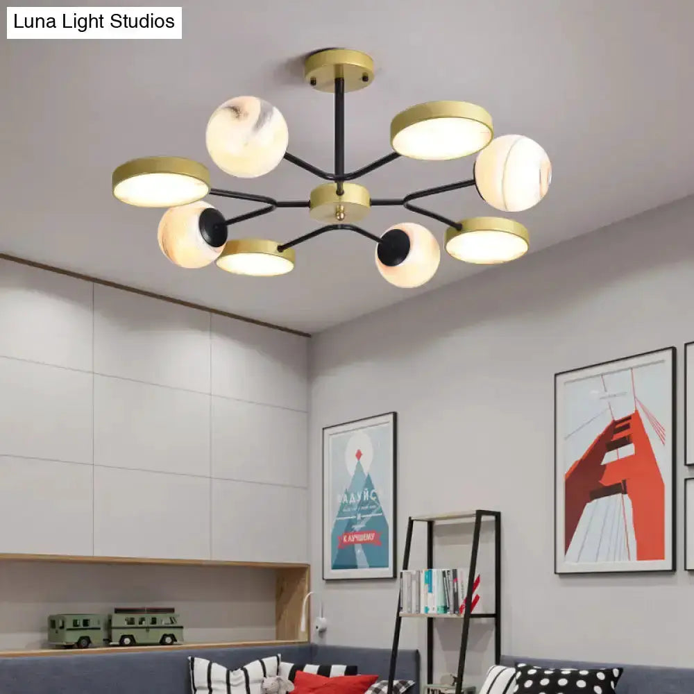 Modern hand blown glass gold chandelier with black arms and swirled globes Decorbites on Tampa Home & Garden Store