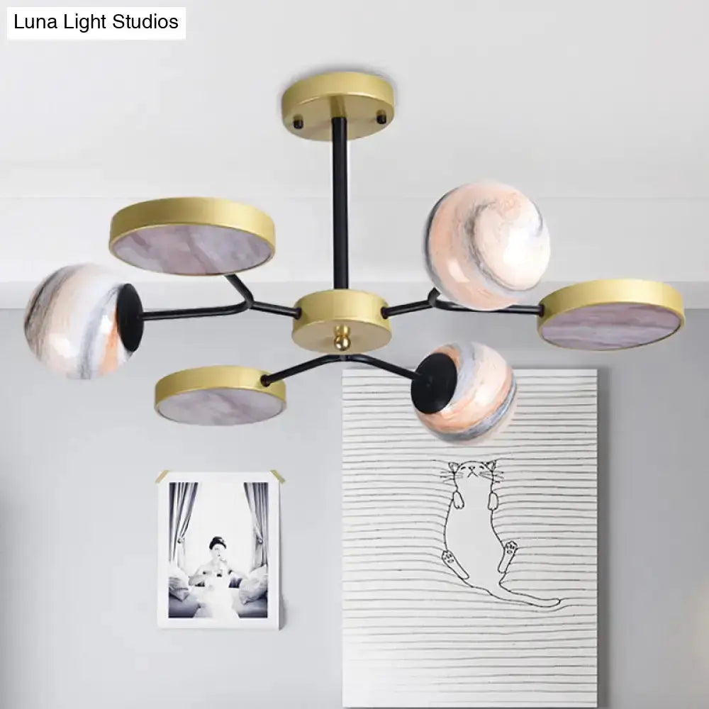 Modern hand blown glass globe chandelier with gold rings, black arms, pink marbled accents on Tampa Home & Garden Store