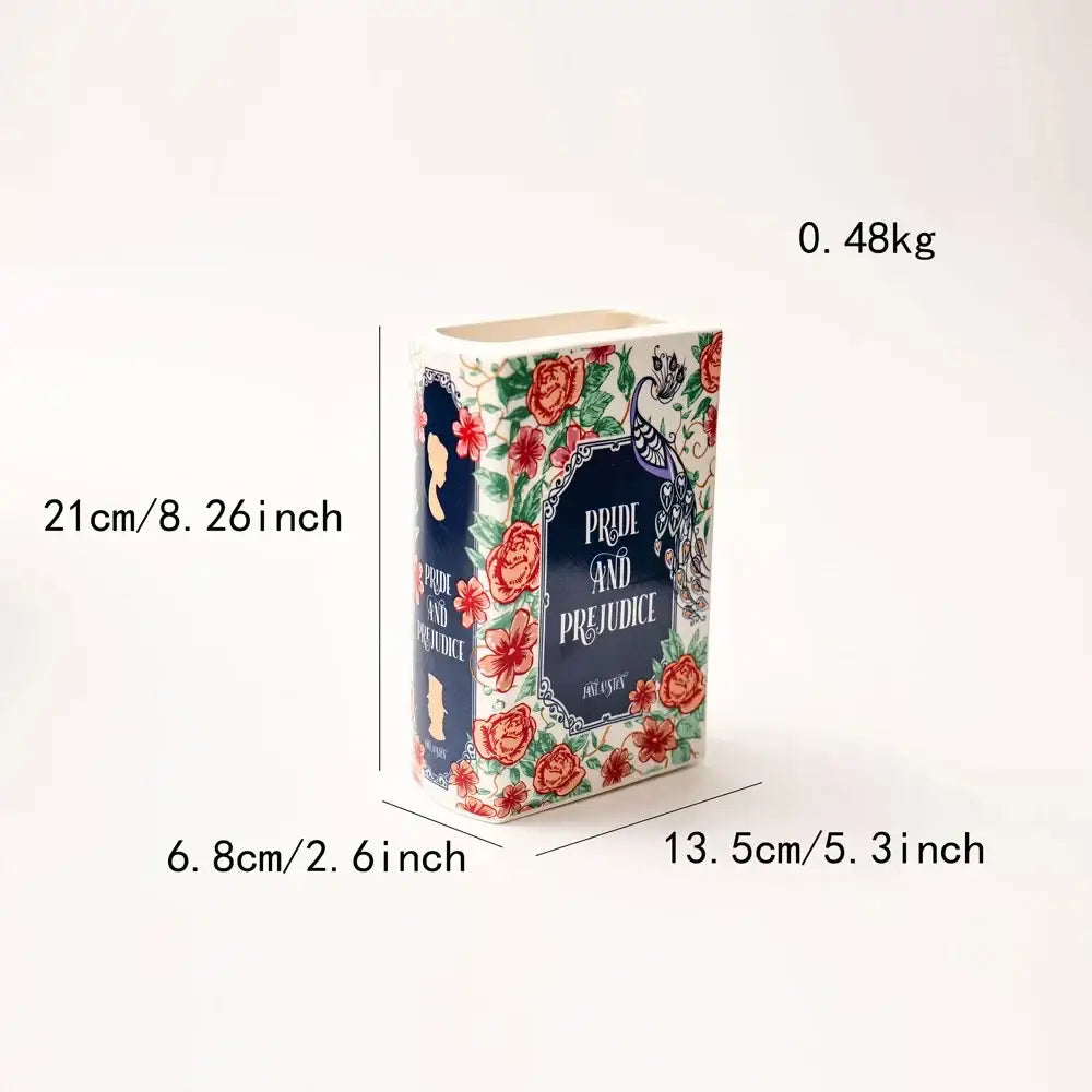 Navy ceramic book vase with colorful floral border and book-style navy label Pride and Prejudice on Tampa Home & Garden Store