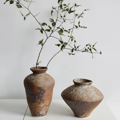 Two brown Zen ceramic vases with weathered glaze; tall branch vase and squat bulbous vase on Tampa Home & Garden Store