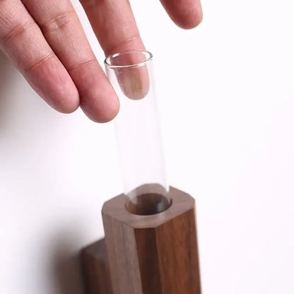 Dark wood wall vase with clear glass tube by Decorbites on Tampa Home & Garden Store