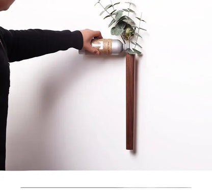 Dark Wood Wall Vase by Decorbites, vertical wooden wall-mounted vase with eucalyptus stems on Tampa Home & Garden Store