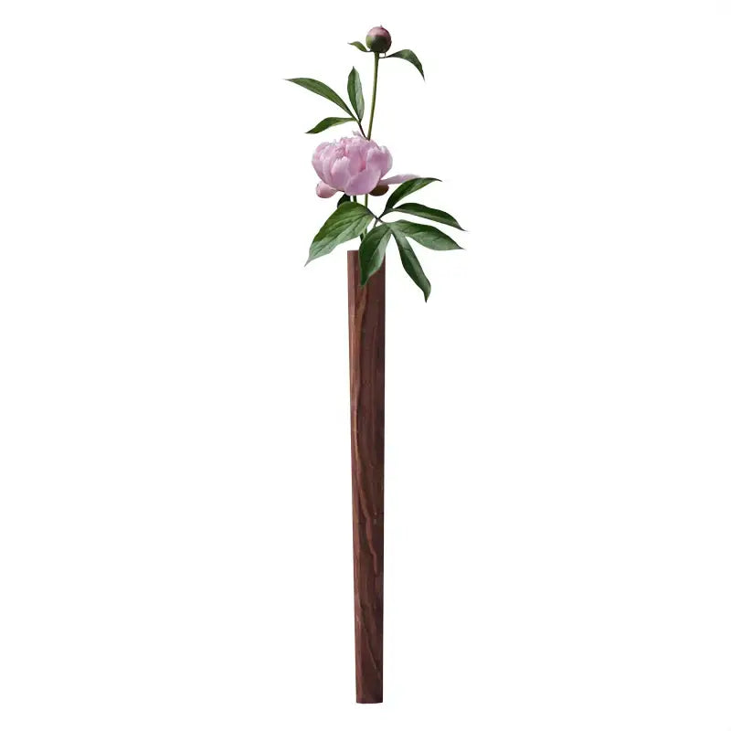 Dark wood wall vase with a pink peony and green leaves on Tampa Home & Garden Store