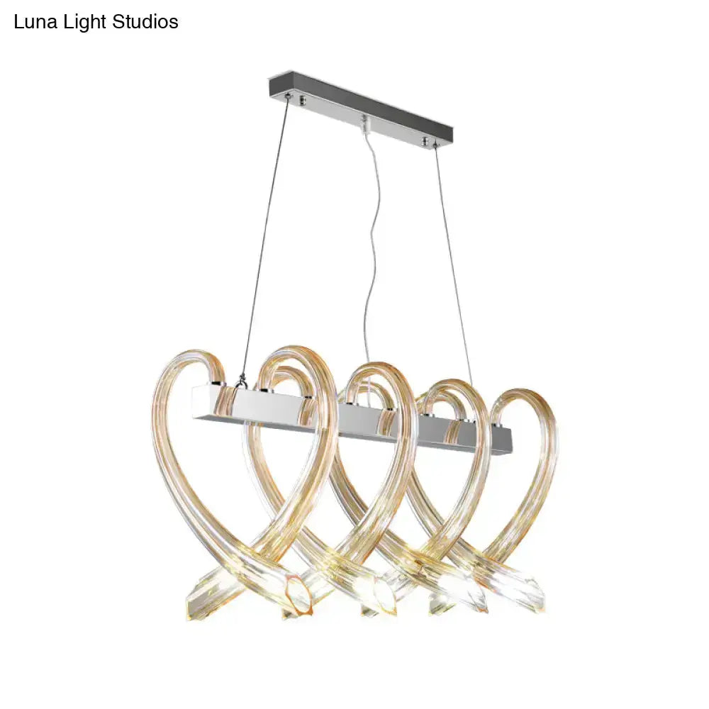 Modern amber glass heart island light pendant with chrome bar and four loops by Decorbites on Tampa Home & Garden Store