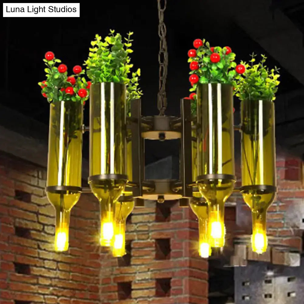Green glass bottle chandelier with gold hardware and plant accents by Decorbites on Tampa Home & Garden Store