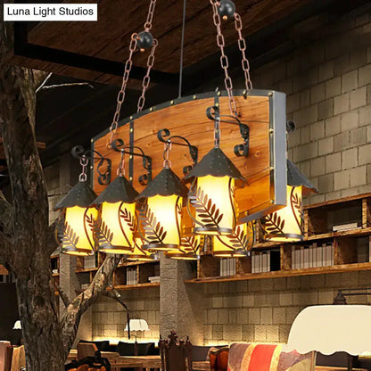 Rustic wood and black lantern island pendant light with multiple amber glass lanterns Decorbites on Tampa Home & Garden Store