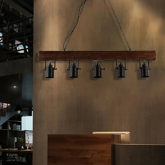 Black metal kitchen pendant lights by Decorbites, five hanging fixtures from a wood beam on Tampa Home & Garden Store
