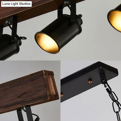 Three black metal kitchen pendant lights with cylindrical shades and amber interiors on Tampa Home & Garden Store