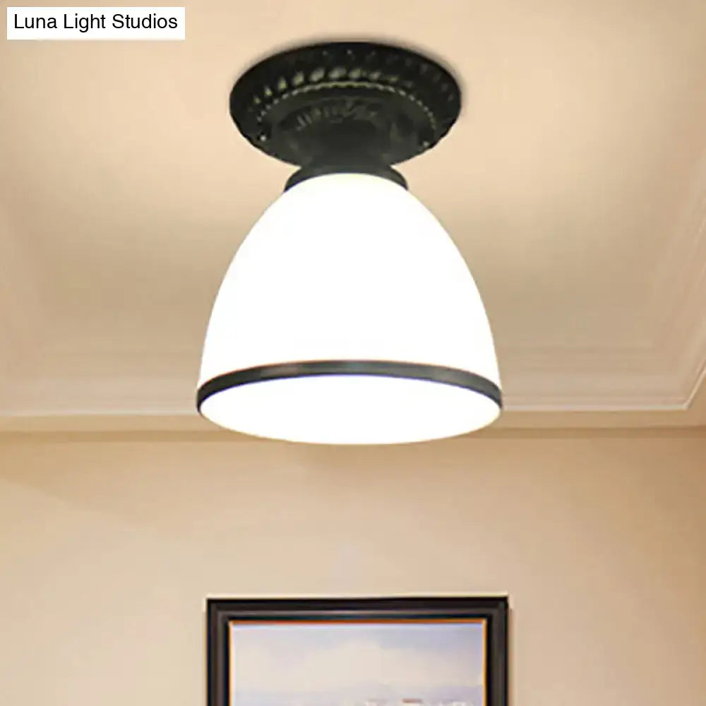 White glass flush mount ceiling light with black metal canopy on Tampa Home & Garden Store