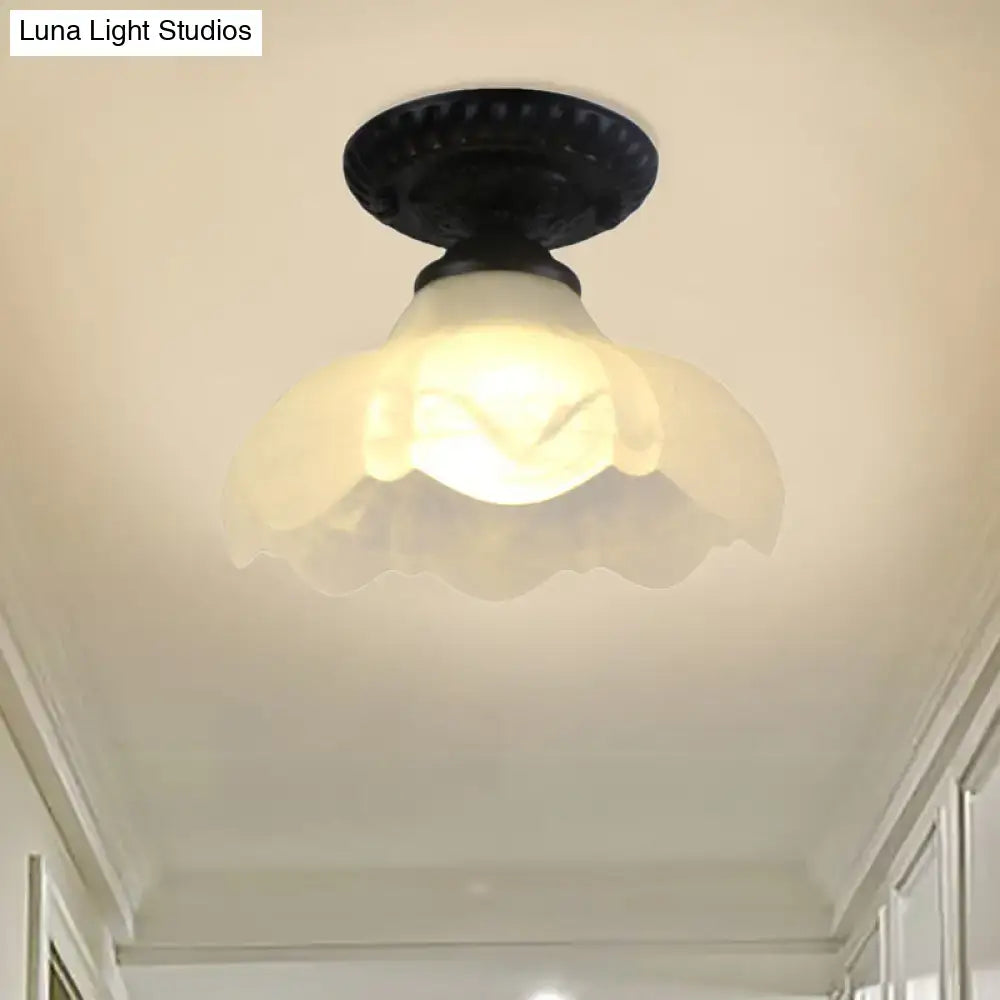 White glass flush mount ceiling light by Decorbites with a scalloped shade on Tampa Home & Garden Store