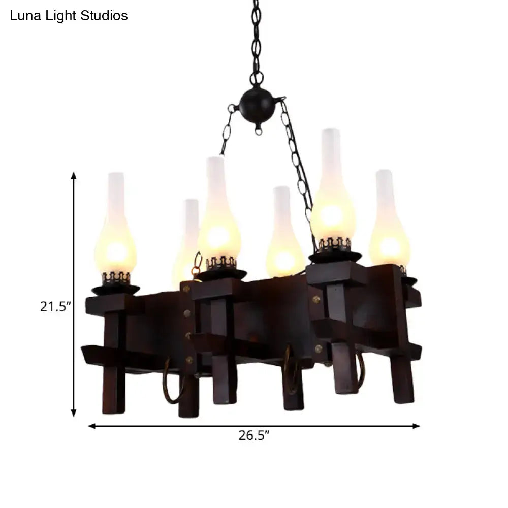Black frosted glass chandelier on wood beam with five candle-style bulbs on Tampa Home & Garden Store