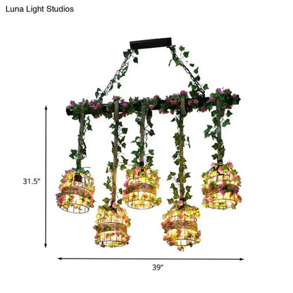 Decorbites industrial black cage island pendant lights with six flower-adorned cages on Tampa Home & Garden Store