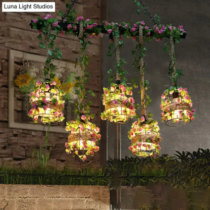 Five black metal cage pendant lights with pink floral vines and warm glow Decorbites on Tampa Home & Garden Store