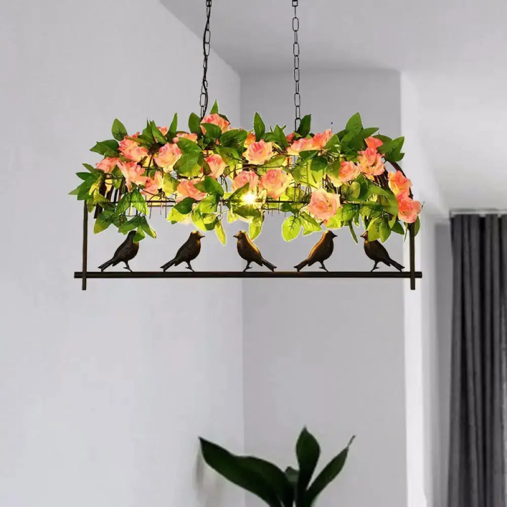 Industrial metal birdcage pendant light with pink rose accents and green foliage by Decorbites on Tampa Home & Garden Store