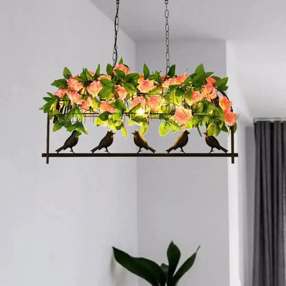 Industrial metal birdcage pendant light with pink rose accents and green foliage by Decorbites on Tampa Home & Garden Store