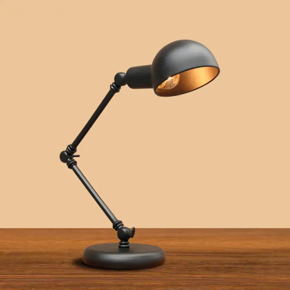 Black Gold Swing Arm Lamp with black metal adjustable arm and gold interior shade on a round base on Tampa Home & Garden Store
