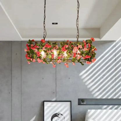 Industrial floral brass pendant light with pink roses and greenery, chain hung on Tampa Home & Garden Store