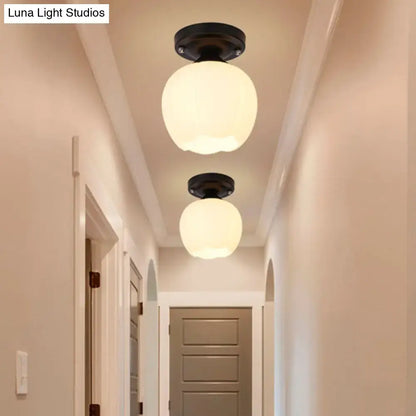 Bronze black glass ceiling light flush mount; pair of frosted globes in hallway on Tampa Home & Garden Store