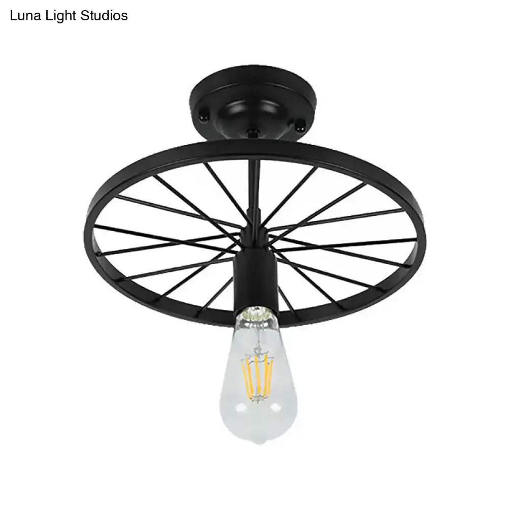 Black wheel ceiling light from Decorbites, flush-mount with Edison bulb on Tampa Home & Garden Store
