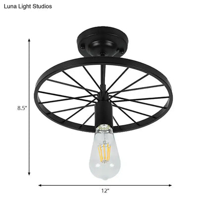 Black wheel ceiling light by Decorbites; metal wheel shade with Edison bulb, 12in wide on Tampa Home & Garden Store