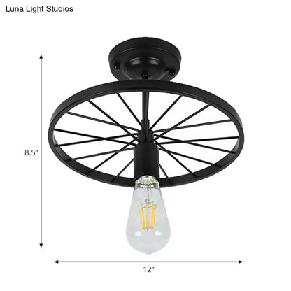 Black wheel ceiling light flush mount by Decorbites, 12 in wide metal frame with Edison bulb on Tampa Home & Garden Store