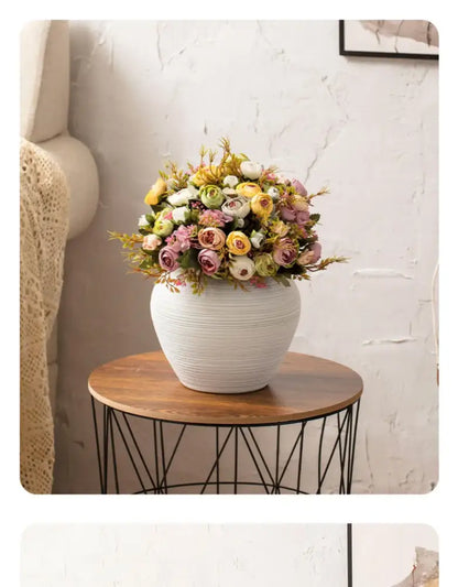 White ribbed ceramic vase by Decorbites with pastel flower bouquet on Tampa Home & Garden Store