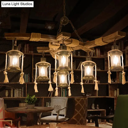 Wood Glass Lantern Chandelier with rope-wrapped timber frame and six hanging glass lanterns on Tampa Home & Garden Store