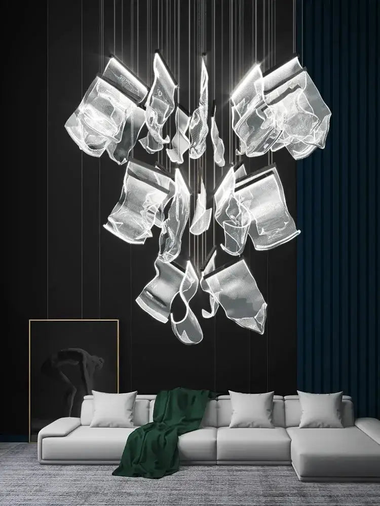 Modern gold sculptural LED ceiling chandelier with glass bloom pendants over a white sofa on Tampa Home & Garden Store