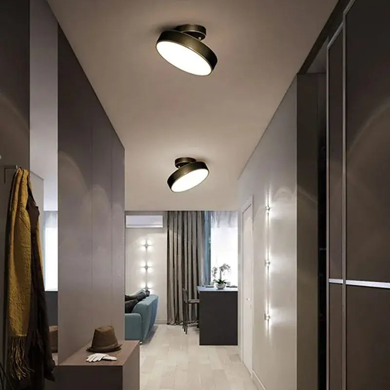 Gold LED flush mount ceiling lights, two with black rims in a modern hallway on Tampa Home & Garden Store