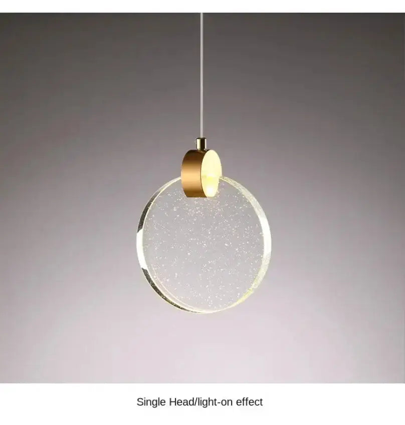 Modern gold LED crystal pendant light with circular crystal disc and brass canopy for bedroom on Tampa Home & Garden Store