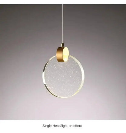 Modern gold LED crystal pendant light with circular crystal disc and brass canopy for bedroom on Tampa Home & Garden Store