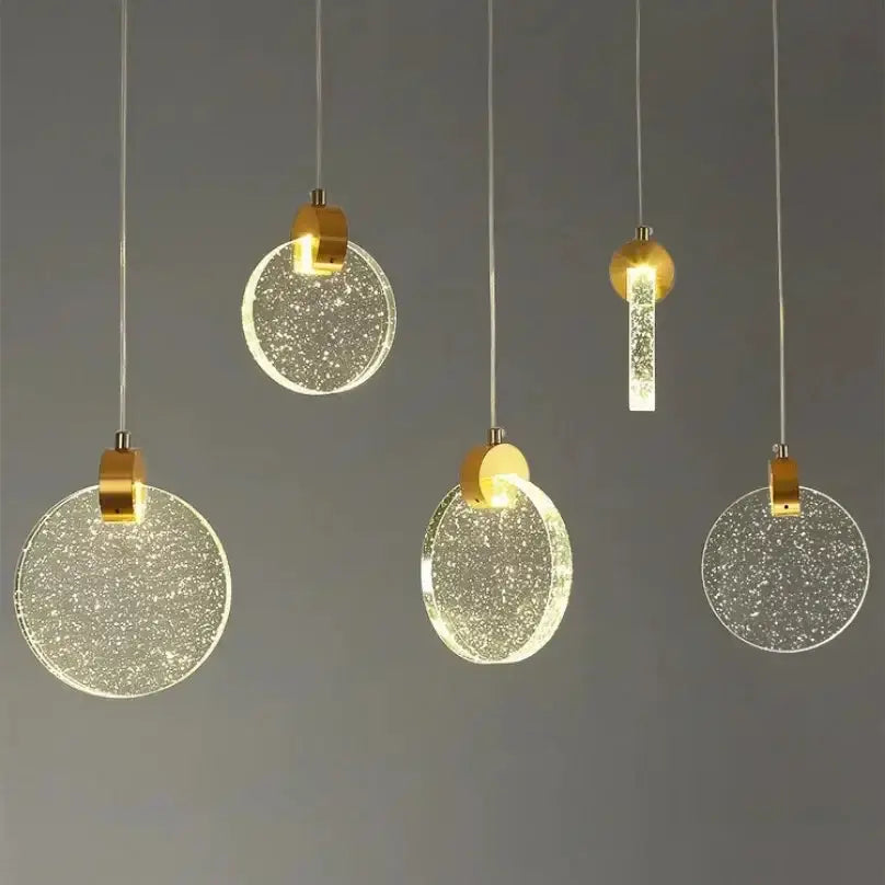 Modern gold LED pendant lights set of five by Decorbites with crystal discs and gold mounts on Tampa Home & Garden Store